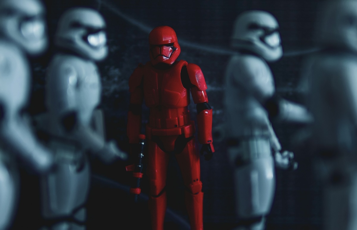 A red Stormtrooper stands out against white ones to symbolise uniqueness.