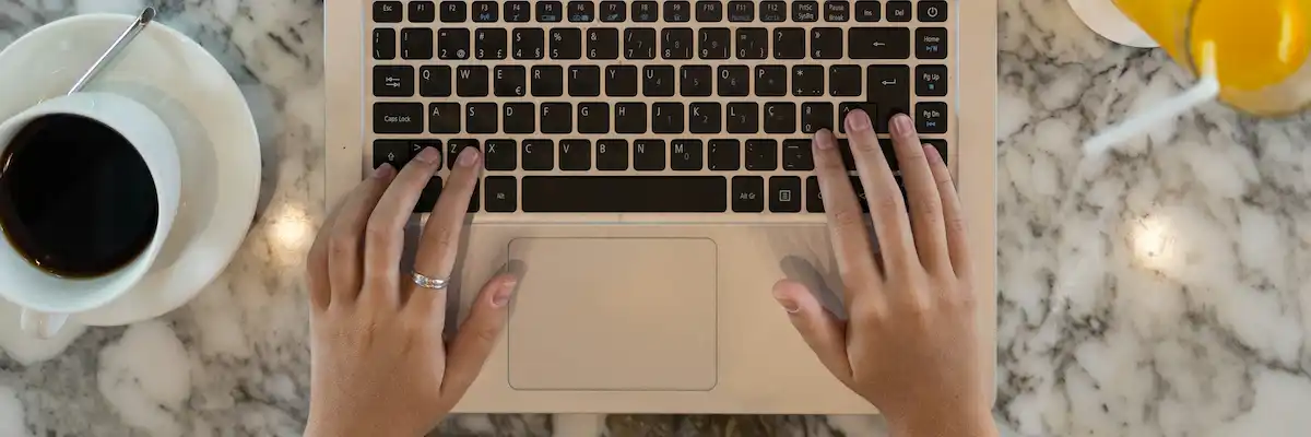 A person using a laptop compuetr, used to illustrate online media training